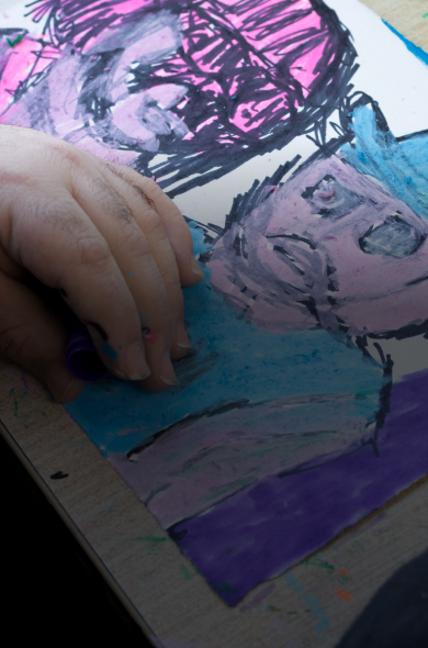 APA artist, Adrian Lazzaro's hand resting on his artwork.