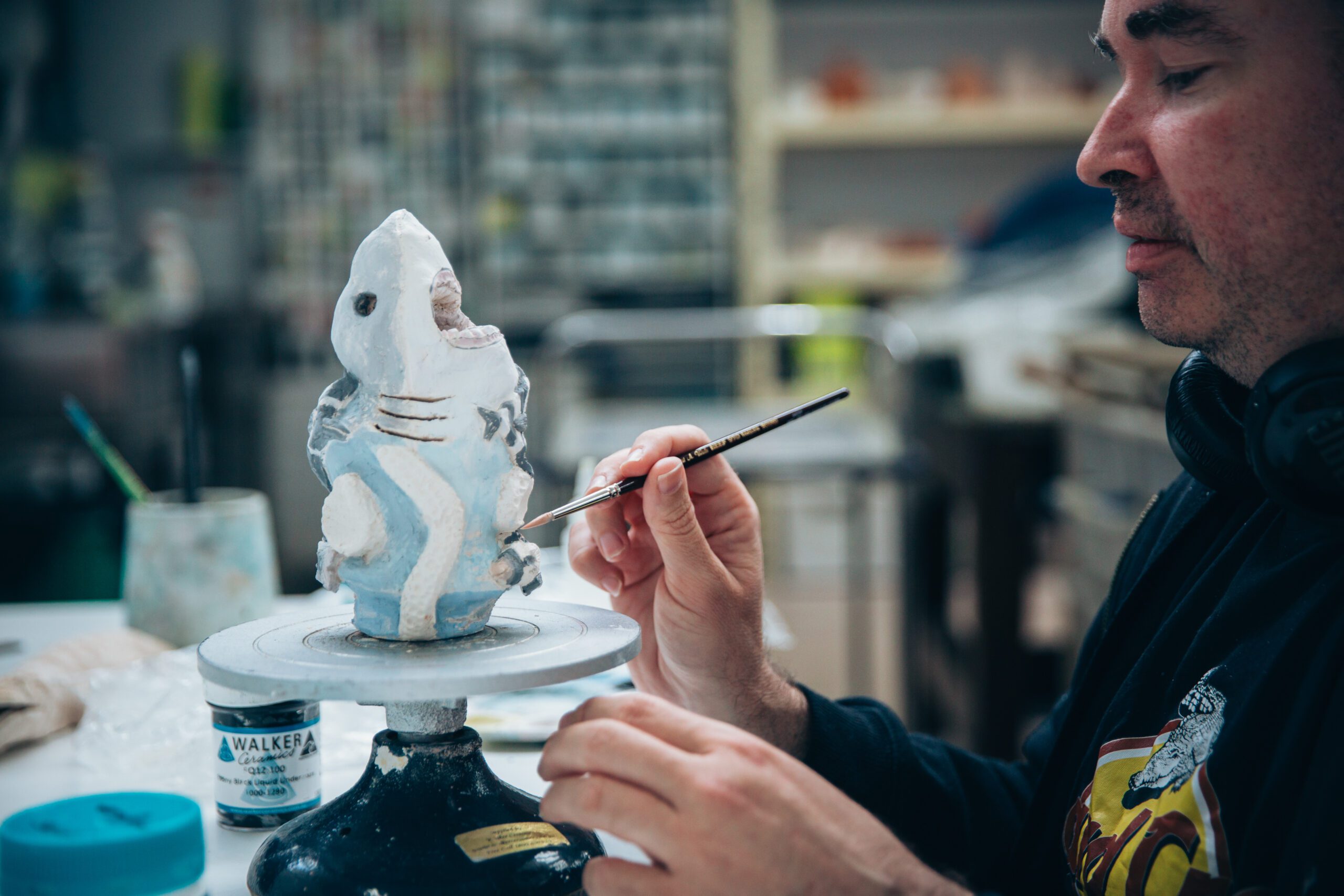 Miles Howard-Wilks working on ceramic shark sculpture