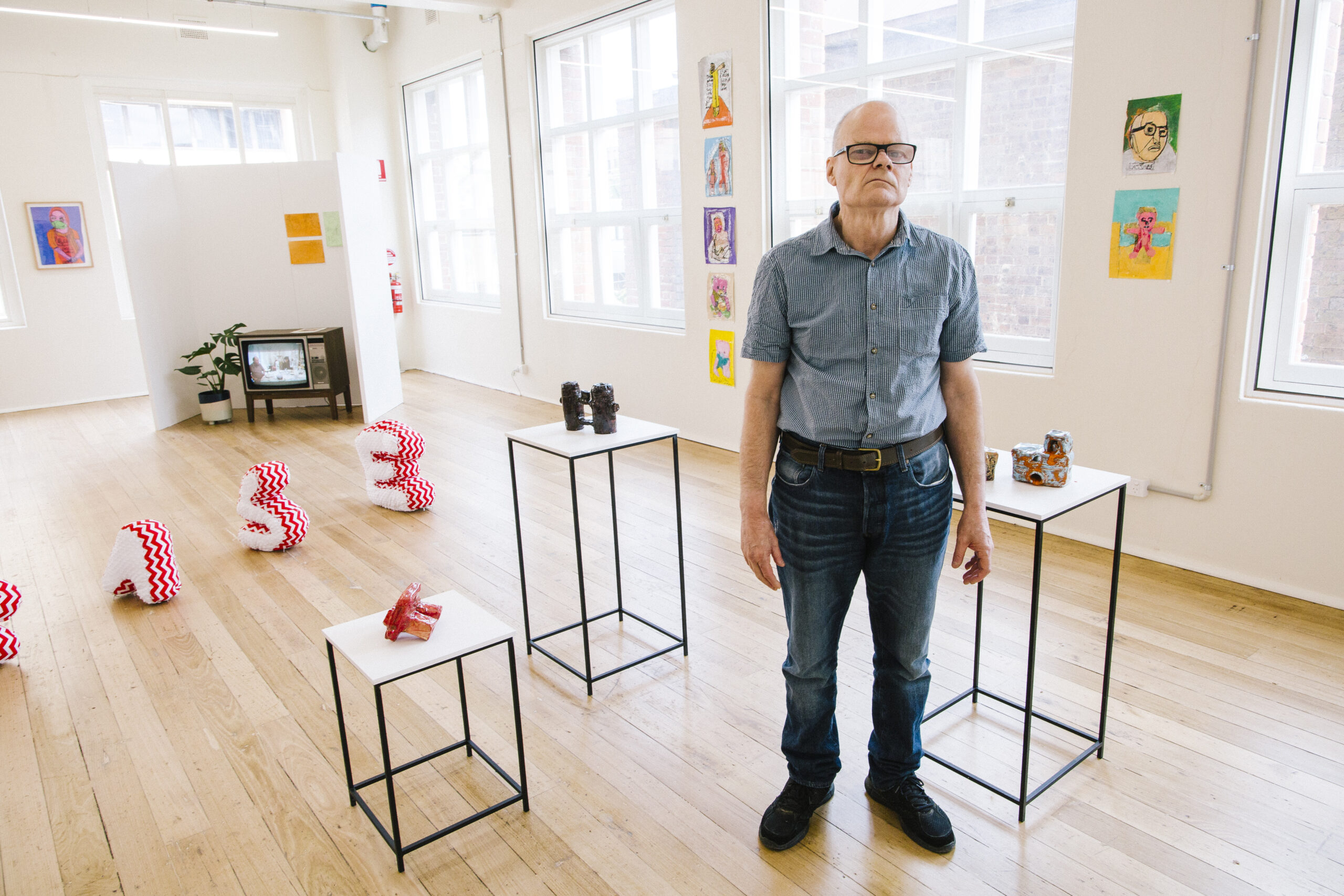 Alan Constable standing in front of his ceramic binoculars