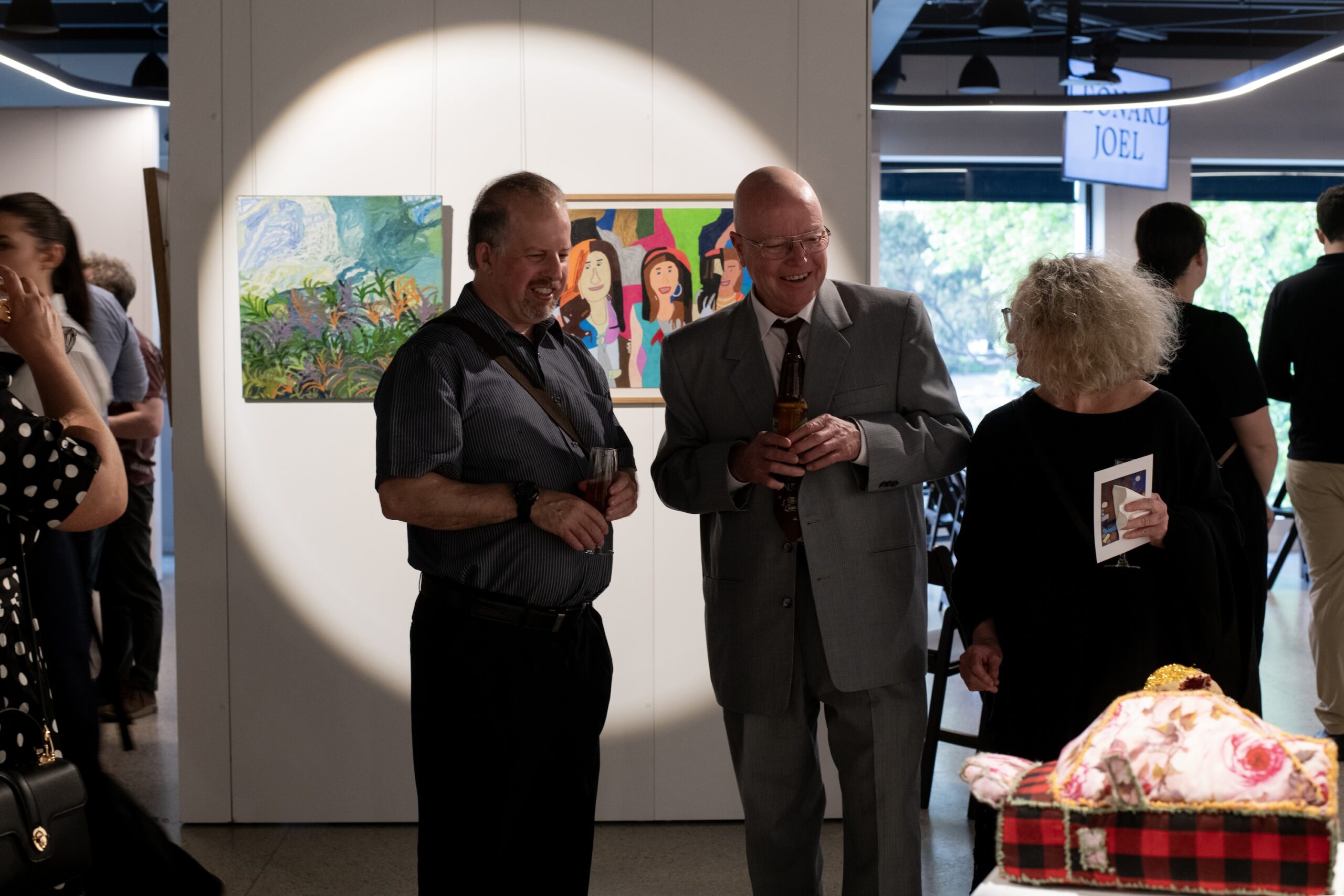 APA artist Matthew Gove (left) with APA community members at Leonard Joel Auction Rooms