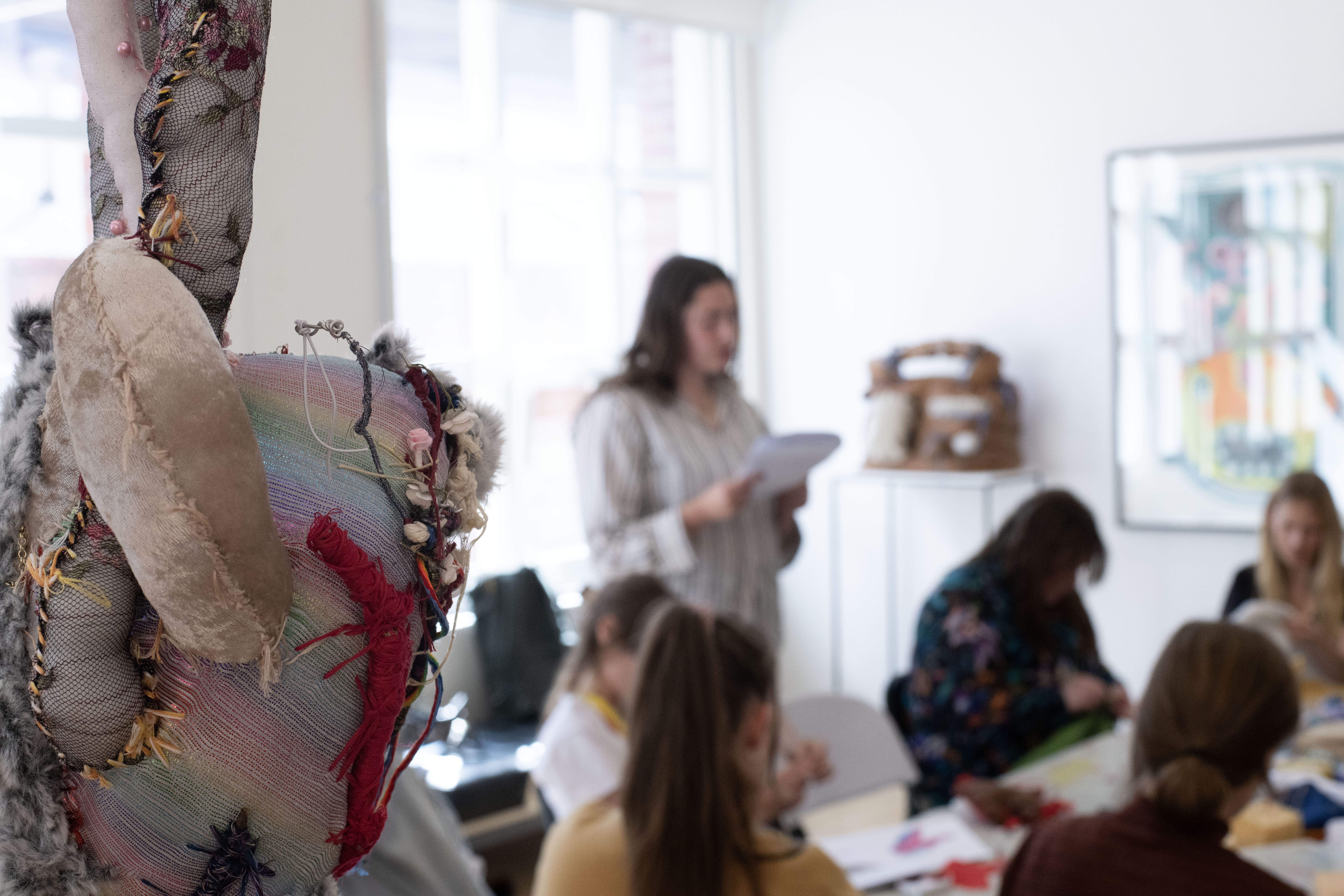Katherine Botten reciting a poem at the Make Your Own Body Parts Workshop