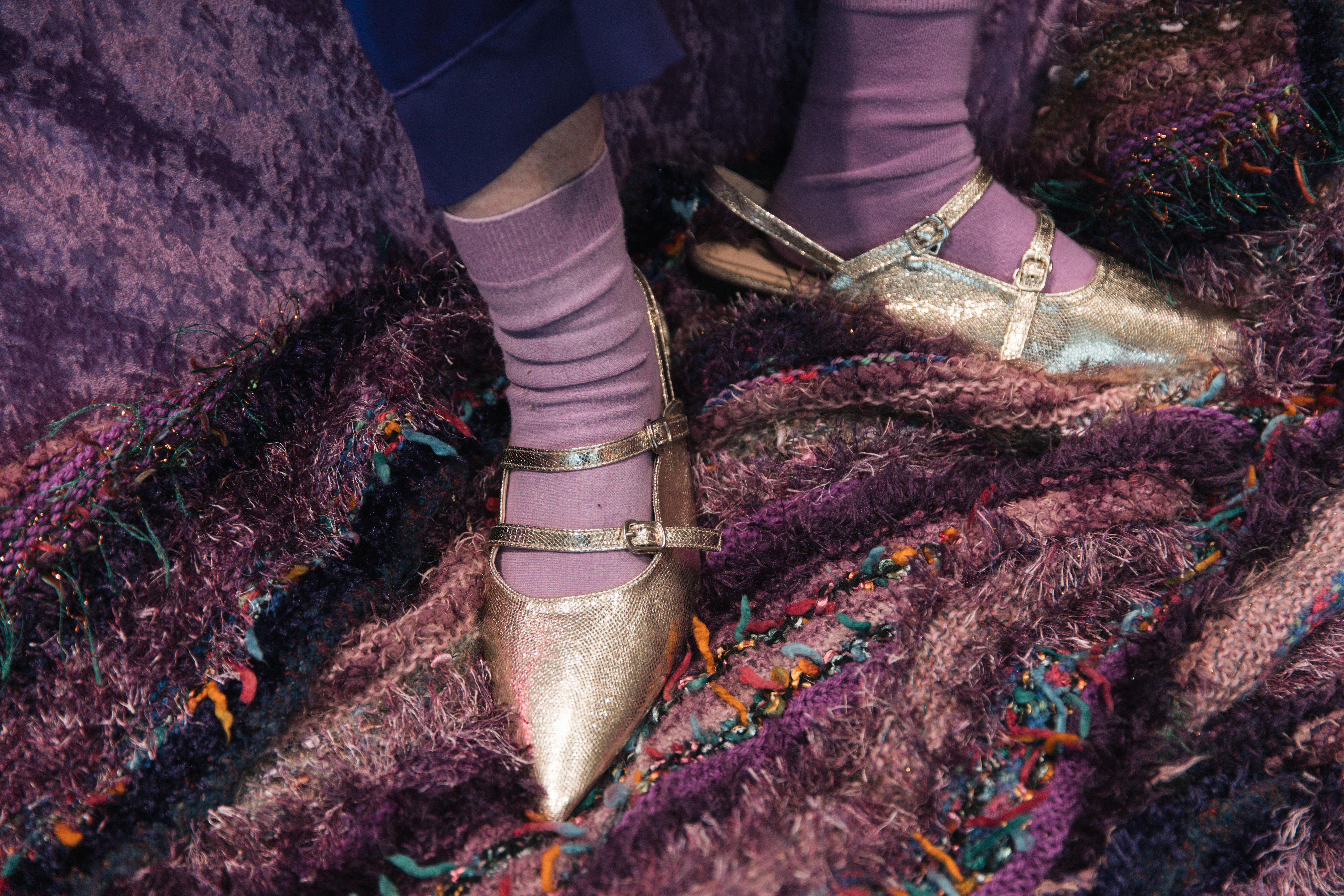Cathy Staughton's shiny silver shoes with purple socks underneath