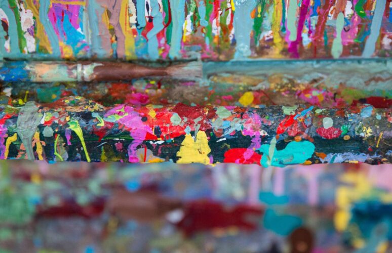 this is a photo of paint splashes on an eisel.
